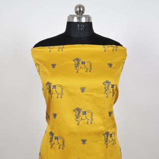 Yellow Party Wear Suit fabric with embroidered cow motifs and silk dupatta